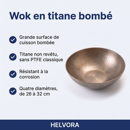 Wok en titane bombé sans revêtement posé sur une plaque de cuisson